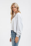 EXPOSED SEAM RELAXED LONG SLEEVE KNIT TOP